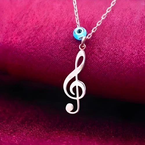 Sanatın Işıltısı: Nazar Boncuklu Sol Anahtarı Kolye-Şans ve Koruma Serisi